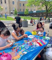 moms and kids at crafts table